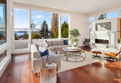 living room with wood floors and white furniture