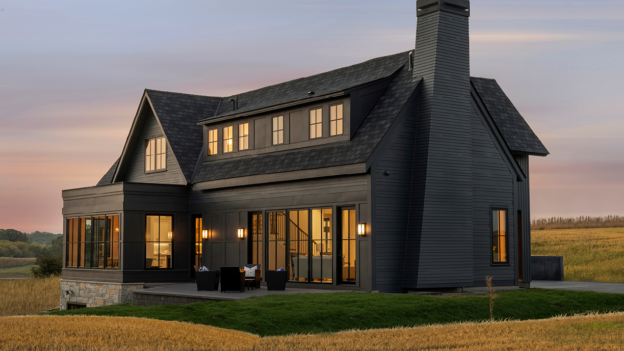 Eye-land home in Stillwater, MN featuring Andersen Windows E-Series casement and picture windows with black exteriors.