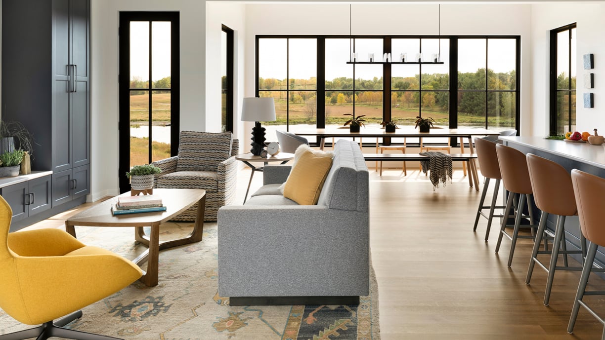 Eye-land home in Stillwater, MN featuring Andersen Windows E-Series picture windows with black interiors.