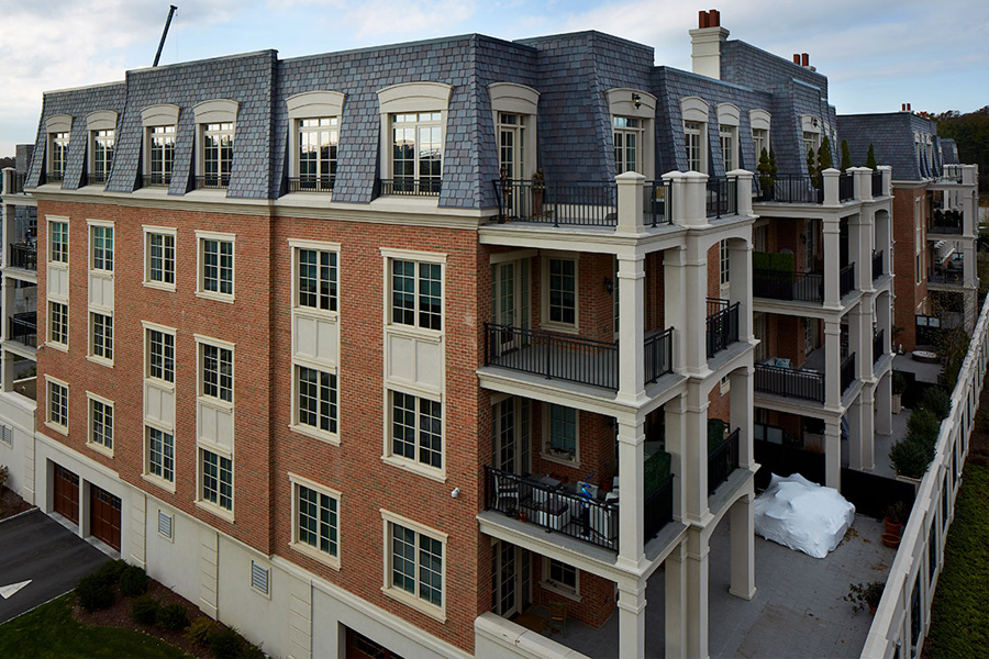 Cape style brick building with dormer windows 