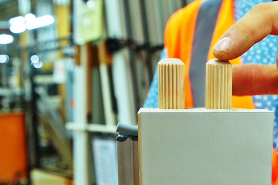 A closeup photo of the dowel end of a profile piece, which is a component of Andersen A-Series patio doors.