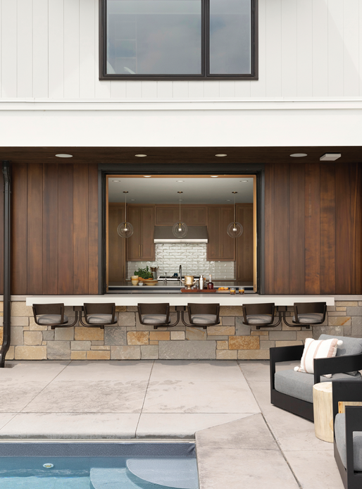 Modern pool area with pass thru window and bar setup