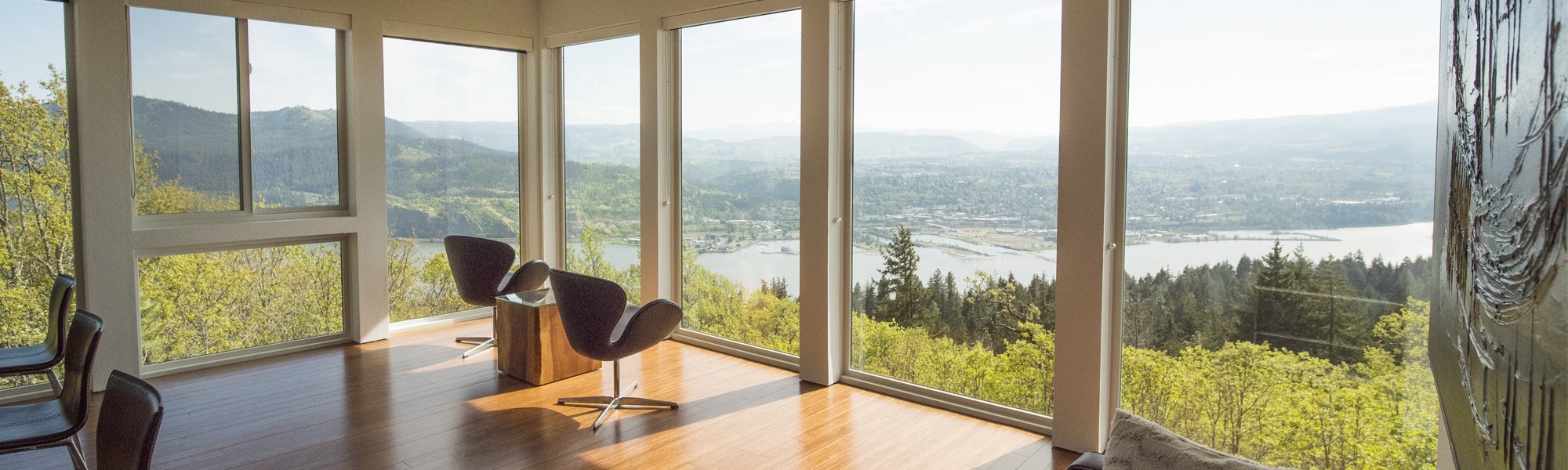 Floor to ceiling windows overlooking stunning river valley views