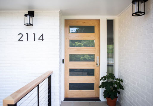 Scandinavian modern front door in natural wood tone