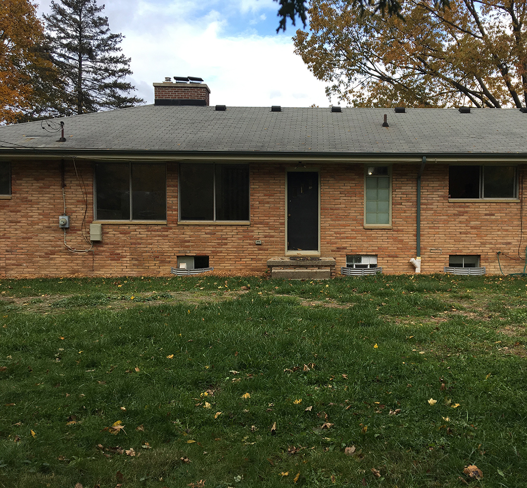 brick ranch style home with no porch