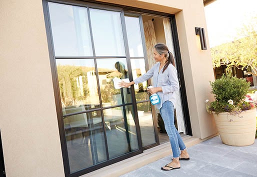 Woman demonstrates window cleaning