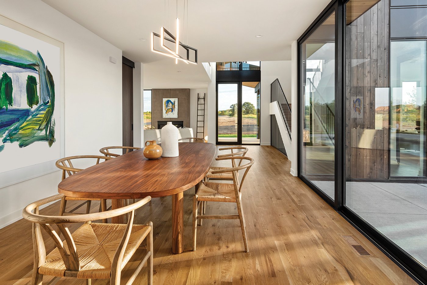 A dining room space with a MultiGlide Door on one side.