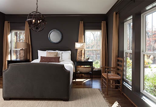 Dark and Urbane Bronze Bedroom with White Sheets and White Windows 