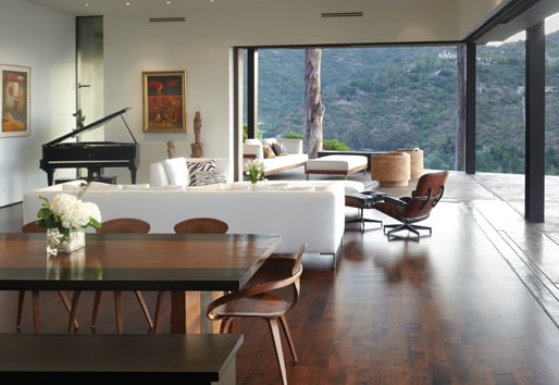 cozy living space with wall to wall big doors overlooking foothills