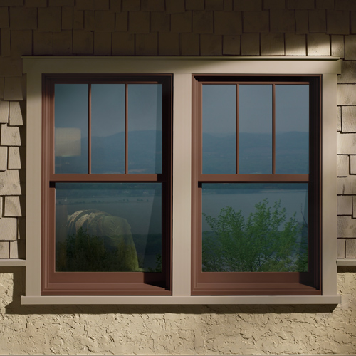exterior of home with shake siding and pops of red in the trim