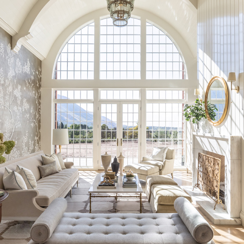 Elegant living space with hug window wall and doors with grilles