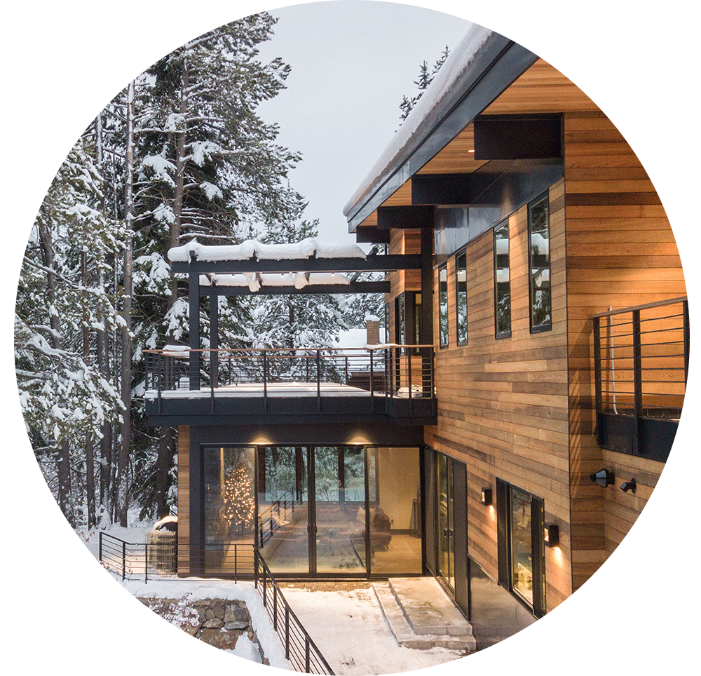 Modern style home with black windows in the winter