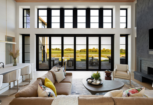 Window wall with many windows and doors with black frames