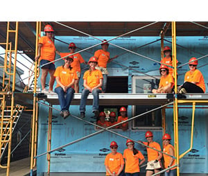 30 women representing Andersen Corporation were hard at work framing, applying foam board and house wrap, installing Andersen windows and sheathing the roof of a house at a Twin Cities Habitat for Humanity Women Build in Saint Paul, Minnesota. 