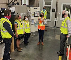 People on manufacturing floor in PPE. Andersen Recognized for ‘Innovation in Crisis’ during COVID-19 Pandemic.