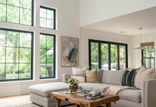 living room with larger black framd andersen windows