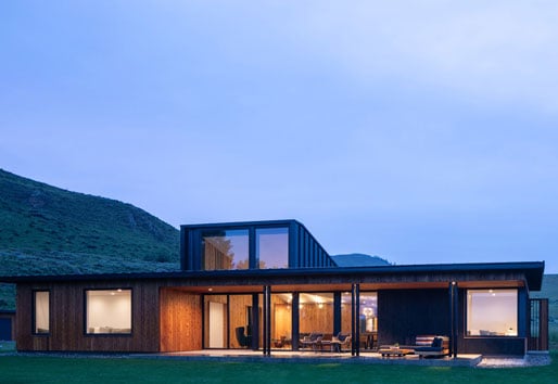modern panorama house with Andersen picture windows mountains in the background