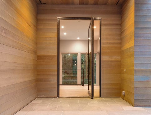 Andersen Windows entry pivot door in a modern home.