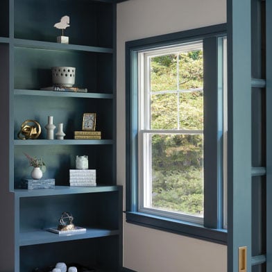 blue framed window in kitchen pantry