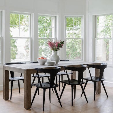 dining room with white framed andersen windows