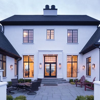 two story white home with black framed windows
