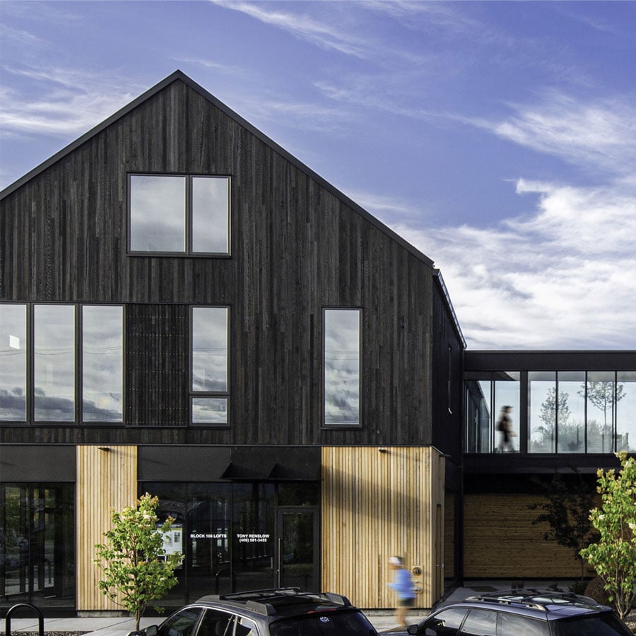 Black multi-family home featuring Andersen Windows - multi-family runner-up of the 2022 Dwell contest.