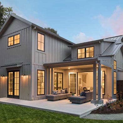 Outside of a modern home featuring Andersen 100 Series windows built by GHG Builders.