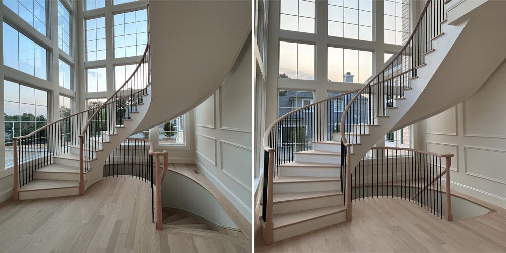 A stair tower in a traditional home featuring a curved staircase surrounded by two walls of white-framed windows with colonial grilles.