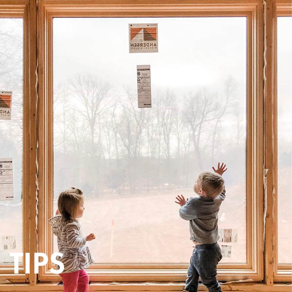 Kids looking out newly installed window with "tips" text overlay