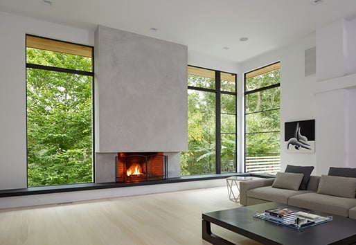 living room with fireplace and Andersen windows