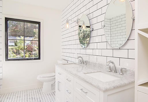 white bathroom with black framed Andersen window