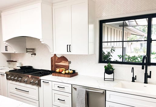 white traditional kitchen with black large grid Andersen windows