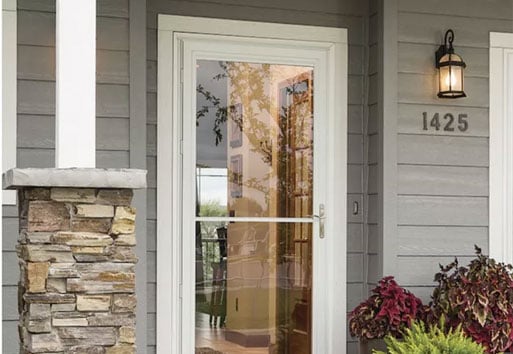 exterior view of house with white storm door