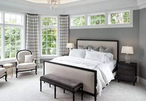 traditional bedroom with white framed windows