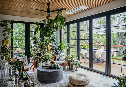 Interior of Hilton Carter living space with plants and sliding glass doors