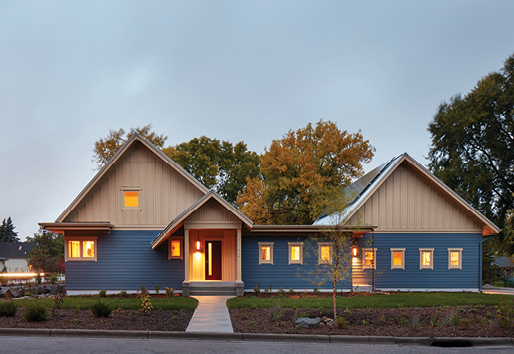 Net Zero Home and Living, House Exterior at Dusk with Solar Panels on Roof