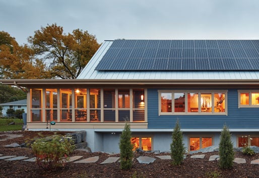 Net Zero Home and Living, House Exterior at Dusk with Solar Panels on Roof