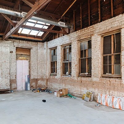 renovation of building showing gutted room during redo