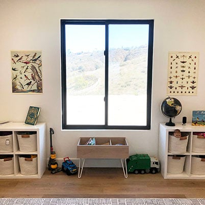 kids room with view of black frame windows