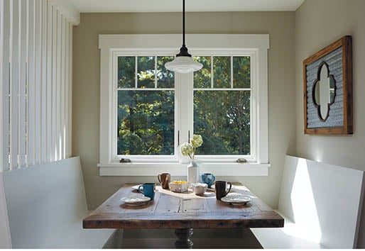 breakfast dining nook with white framed Andersen window