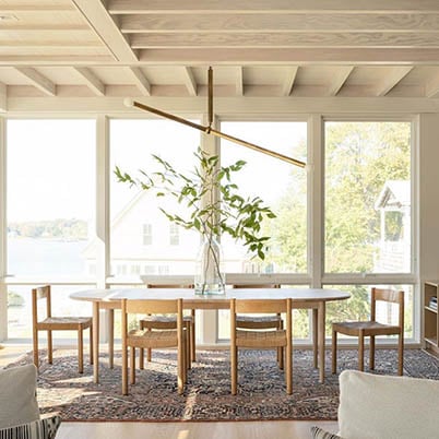 White and wood natural dining room with large windows