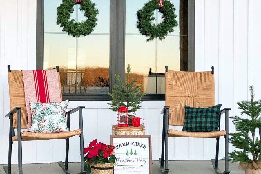 front porch decorated for holidays with rustic decor