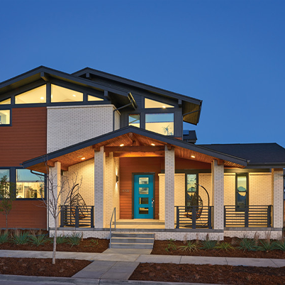 house with mixed materials exterior and blue accents