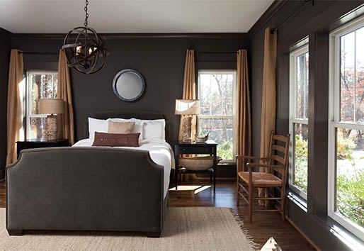 Dark and Urbane Bronze Bedroom with White Sheets and White Windows 
