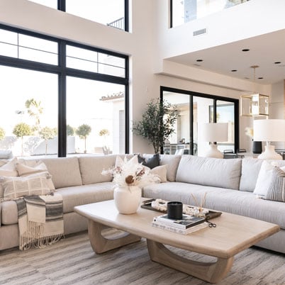 white livingroom design with black frame andersen windows