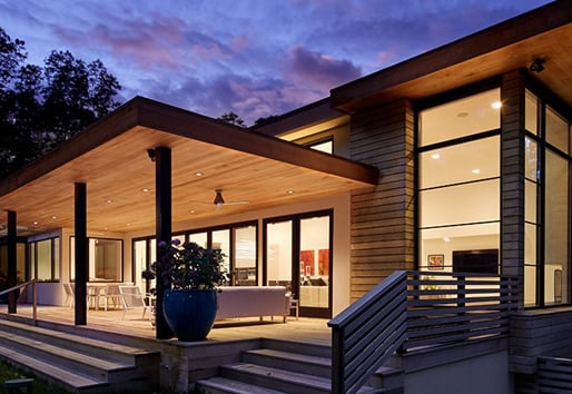 modern wood design house with andersen floor to ceiling windows