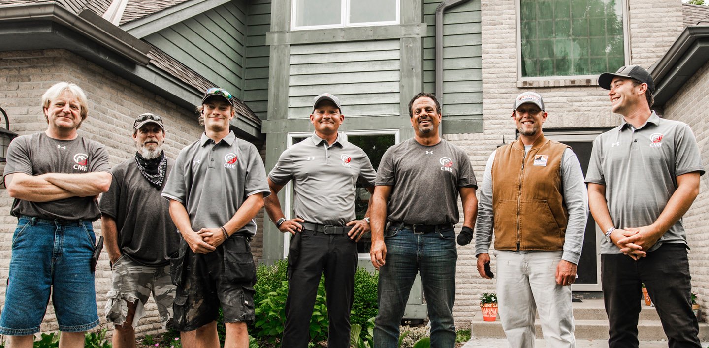 The Central Minnesota Renovations Team with Andersen Rep after installing new 400 Series windows at a home in Vadnais Heights, MN
