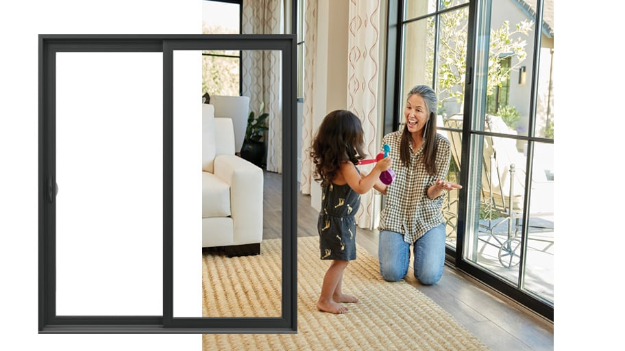 woman and child in from of black framed andersen gliding patio doors