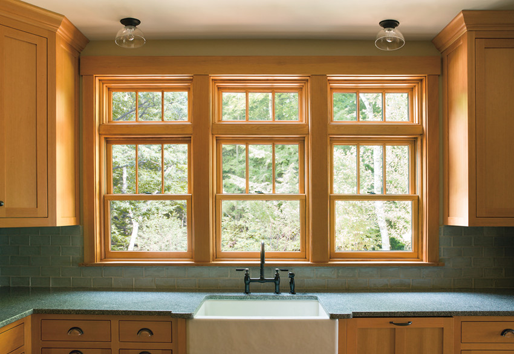 Interior view of kitchen with Andersen wood windows with fractional grilles