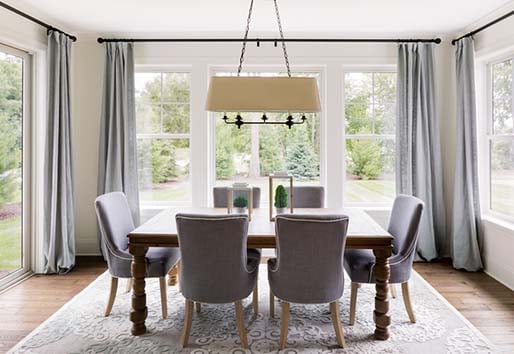 Dining room with white Andersen 100 series single-hung windows